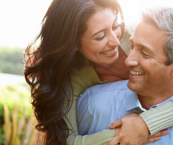 woman embracing man from behind